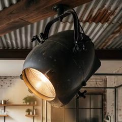 Large old studio light with variable distance from lens.