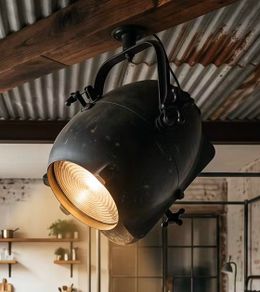 Large old studio light with variable distance from lens.