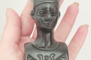 A vintage statuette of the Nefertiti bust.