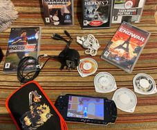 PSP  Console plus 10 games, charger and headphones