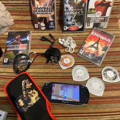 PSP  Console plus 10 games, charger and headphones