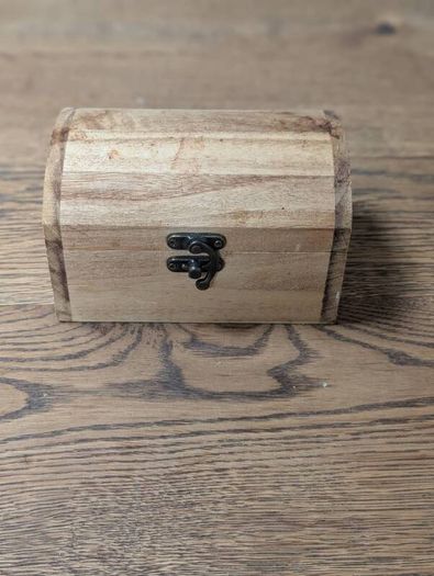 Wooden box with vials and paperbags