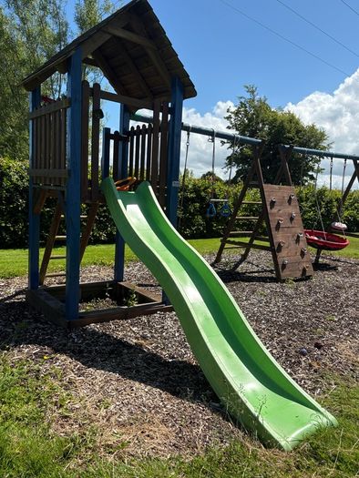 Swing slide climbing wall