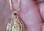 chain and our lady of Guadalupe pendant
