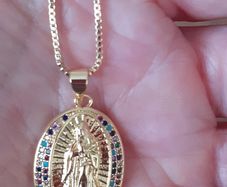 chain and our lady of Guadalupe pendant