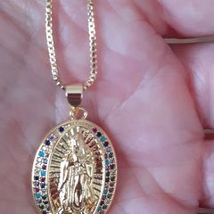 chain and our lady of Guadalupe pendant