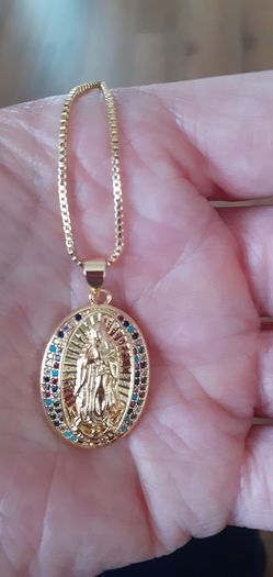 chain and our lady of Guadalupe pendant