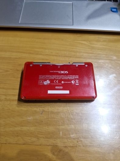 Nintendo 3DS Metallic Red with the original box, charger, and booklets
