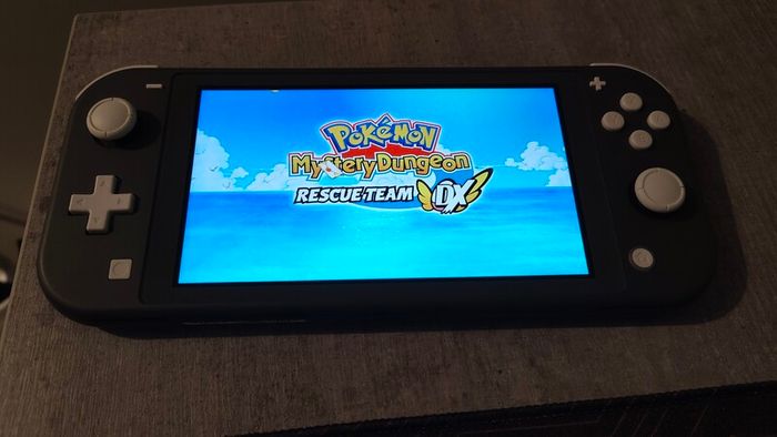 Nintendo switch lite + 64gb SD card + Pokemon mystery dungeon