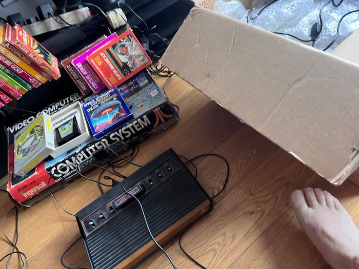 Atari 2600 Space Invaders Woody Atari 2600 with 15 individual games and 14 game Indy 500 driving