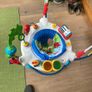 This sturdy, colourful baby bouncer awaits new occupant. The former occupants have discovered mobility. Image 3