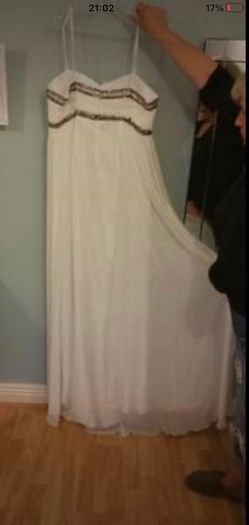 Brand new with tag designer handmade wedding dress by Dresscode. Grecian style with embellishments