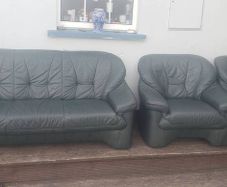 green leather couch and 2 arm chairs