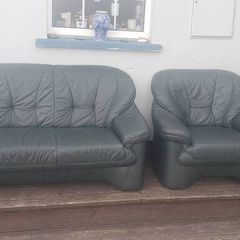 green leather couch and 2 arm chairs