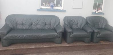 green leather couch and 2 arm chairs