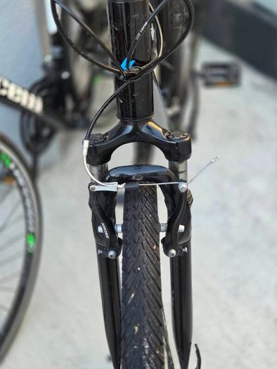 Two bikes one mountain one is a type of racing mountain bike