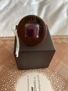 Ring with purple centre stone, signed IKITA