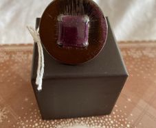 Ring with purple centre stone, signed IKITA