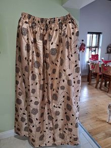 4 pairs of quality lined curtains. Tie backs included.