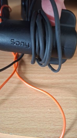 Sony Ericsson W200i , with charger and speakers.
