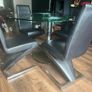 Glass dining table with rotator and 4 leather chairs Image 6