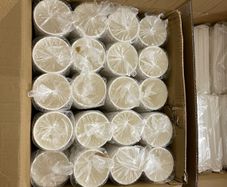 A box of Paper cups and a box of straws