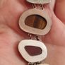 A vintage bracelet featuring natural stone accents. Image 6
