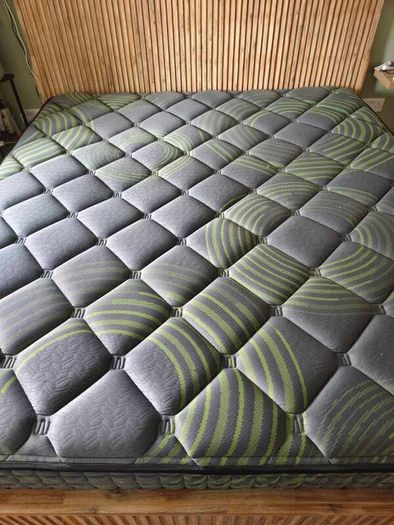 Super King mattress with wooden bed
