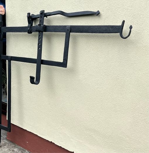 Antique iron crane for fireplace