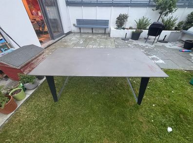 Large concrete resin topped table available free to take.