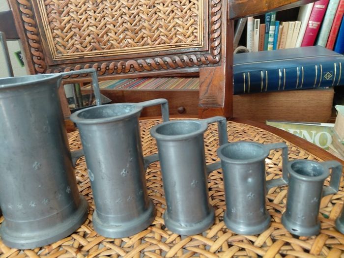Antique French solid pewter measuring tankards Fleurs de lys complete set