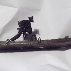 a vintage chinese bronze of  fishing man on a bamboo boat signed