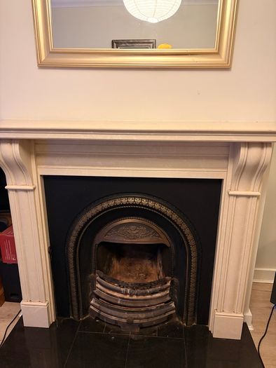 Fireplace stone with cast iron insert