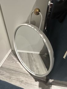 Round HAY Strap Mirror No. 2 in white with a gold-finish wall mount.
