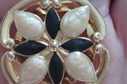 Vintage gold tone dress clip.