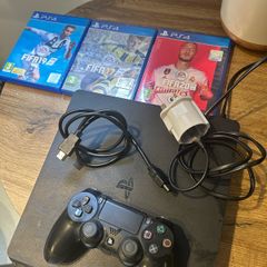 ps4 + controller, hdmi cable and 3 fifa games