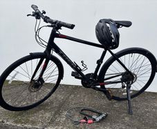 Trek mens bike with Bell helmet and Kryptonite lock