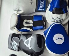 2 sets of boxing gloves and 1 set of punching pad