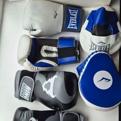 2 sets of boxing gloves and 1 set of punching pad