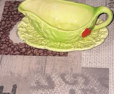 Carlton Ware sauce boat and saucer set, 1930s to 1960s featuring a distinctive green cabbage or lettuce leaf pattern with a red tomato motif