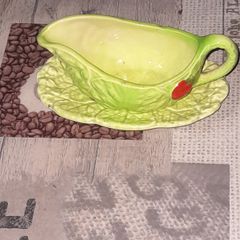 Carlton Ware sauce boat and saucer set, 1930s to 1960s featuring a distinctive green cabbage or lettuce leaf pattern with a red tomato motif