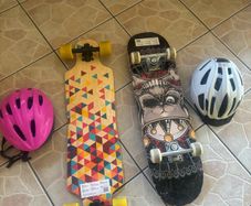 2 skateboards with helmets
