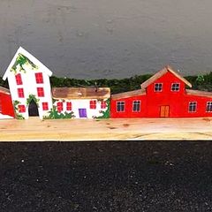 rustic wooden floating shelf display featuring a hand-painted village scene