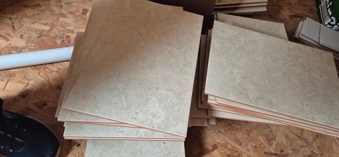 Beige stone-effect ceramic wall tiles