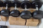 two brand new sets of rubber coated dumbbells 2x12.5kg  2x10kg