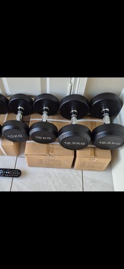 two brand new sets of rubber coated dumbbells 2x12.5kg  2x10kg