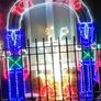 Christmas  toyland outdoor decoration. Bright lights a nutcracker on each side Image 2