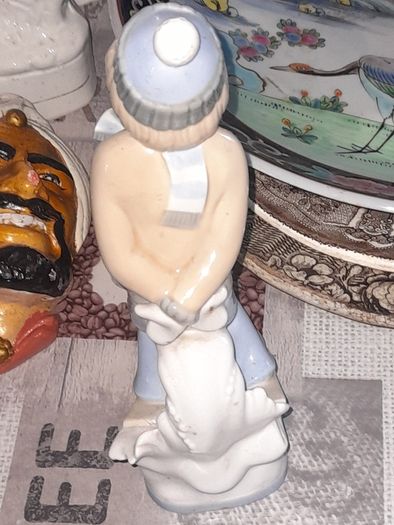 Old Ornament of a Boy in a Winter Hat and Light Colored Clothing on Skis, Made in Spain.