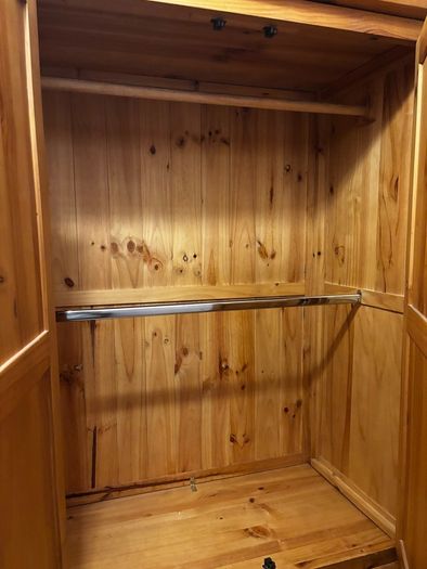 wardrobe with double hanging rails. 2 bottom drawers, 58cms deep and 106cms wide at the widest part.
