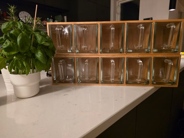 Wooden display shelf with glass jugs